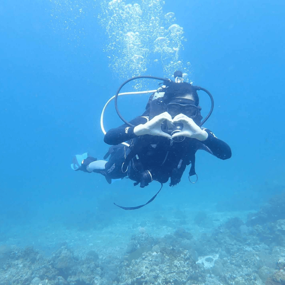 Boracay scuba diving experience with tourist exploring underwater marine life in Boracay Philippines