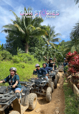 Boracay ATV adventure with tourists riding quad bikes through tropical trails in Boracay Philippines