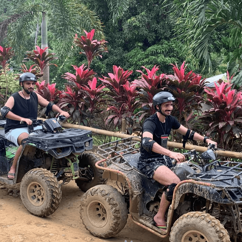 Boracay ATV adventure with tourists riding all-terrain vehicles through jungle trails in Boracay Philippines