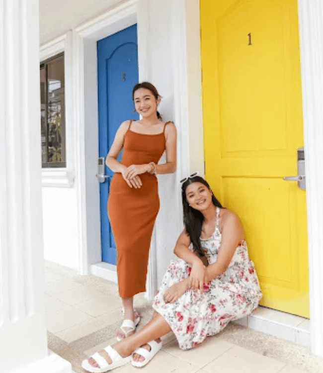 Boracay hotel rooms with colorful doors and tropical guest area.