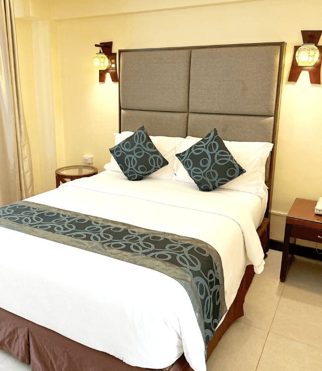 Golden Phoenix Boracay hotel room with comfortable king bed.