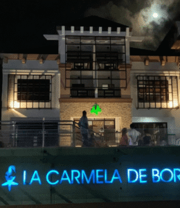 La Carmela de Boracay resort entrance illuminated at night.