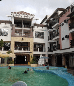 Boracay resort swimming pool with modern hotel surroundings.