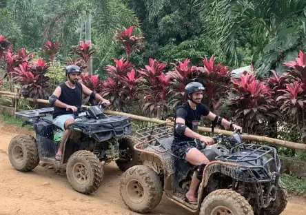 Boracay ATV adventure with tourists riding all-terrain vehicles through jungle trails in Boracay Philippines
